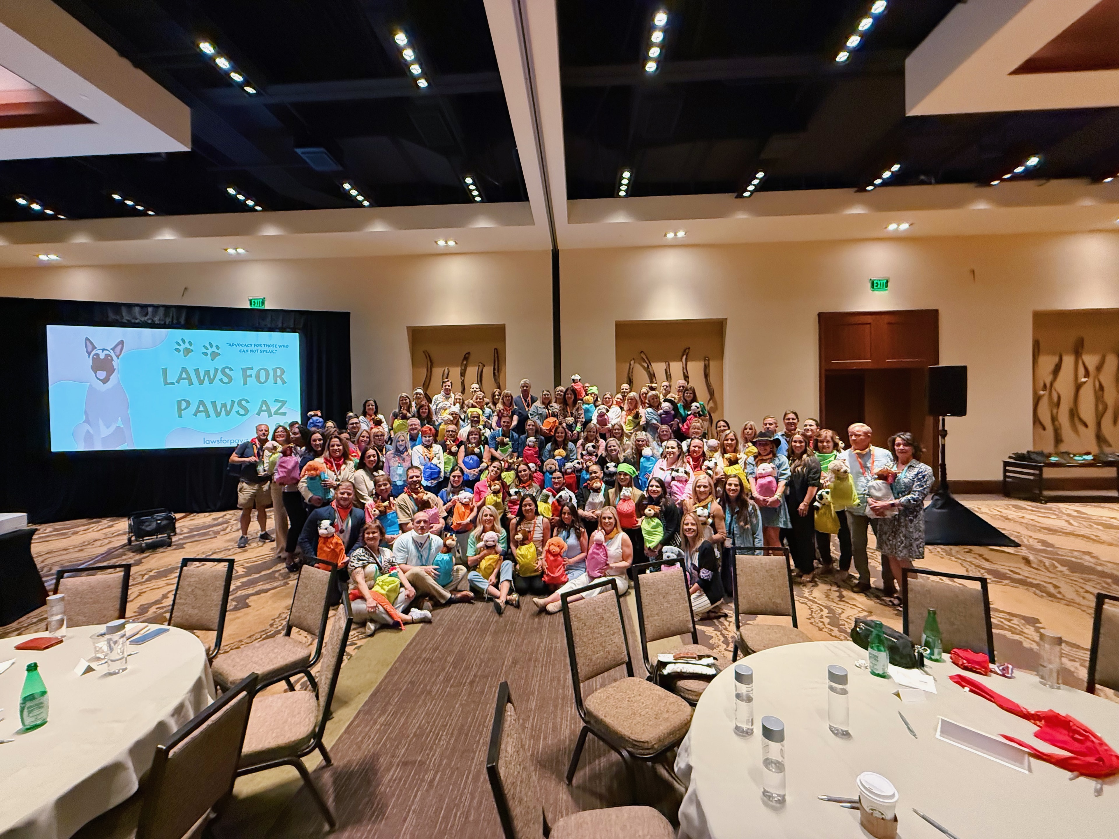 Large group posing at Laws for Paws AZ event