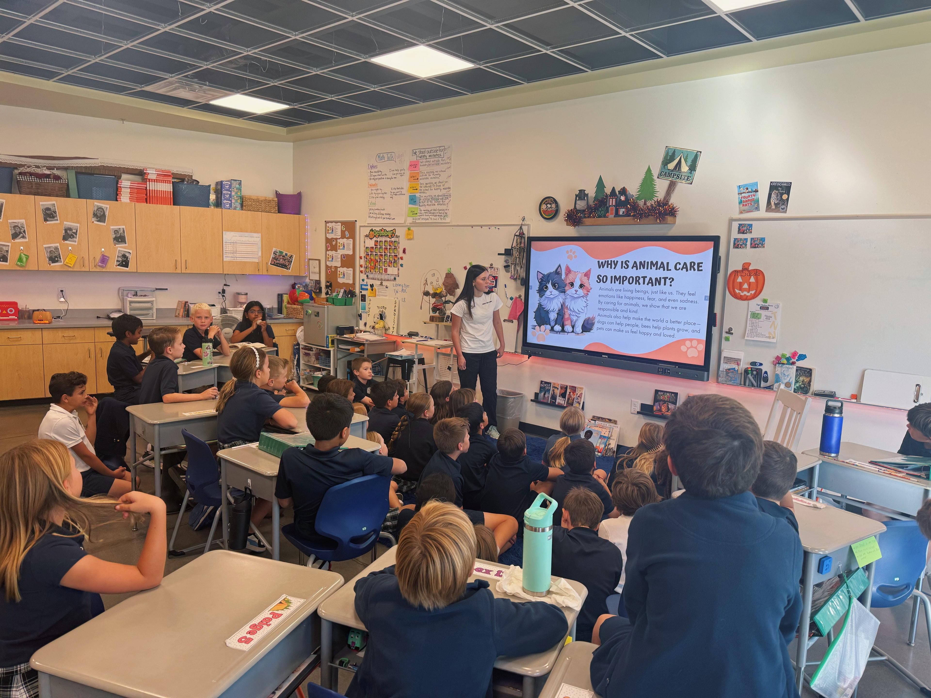 Elementary school class watching animal care presentation